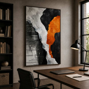 Wood framed bold abstract artwork above a wooden office desk between bookshelves and a window.