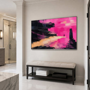Pink and black wall art in a silver frame near a bathroom vanity.
