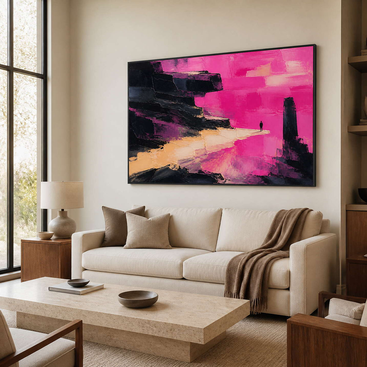 Pink and black abstract wall art above a warm modern living room sofa.