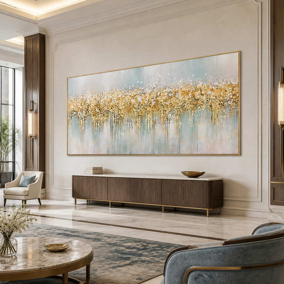 Gold framed pale blue abstract painting above a console in a spacious hotel lounge.