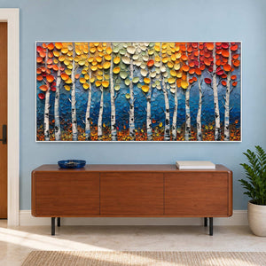 Wide forest artwork above a wooden sideboard on a blue wall.