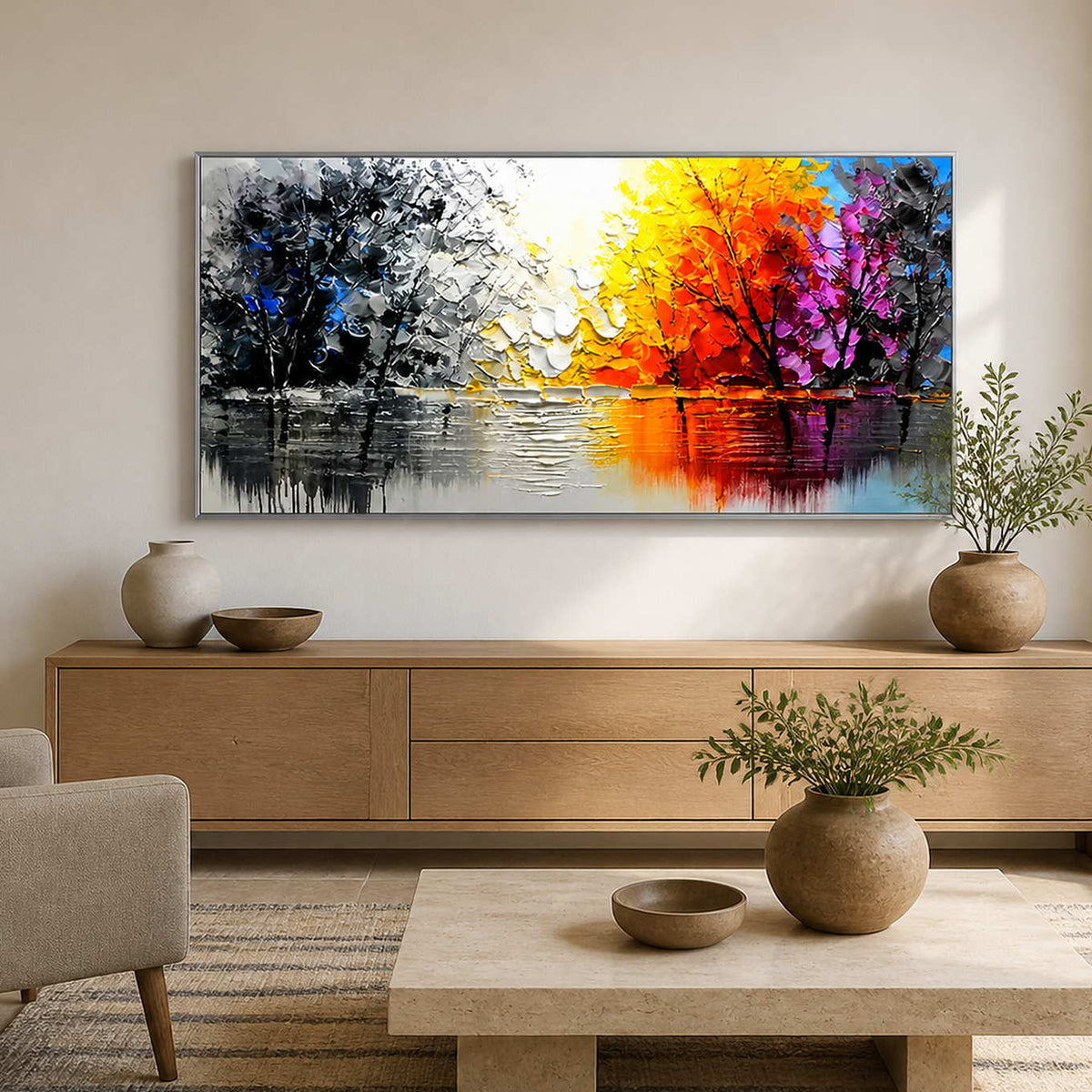 Silver-framed autumn landscape above an oak sideboard beside a family room armchair.