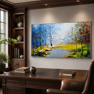 Silver framed textured autumn landscape behind a desk in a walnut home office.