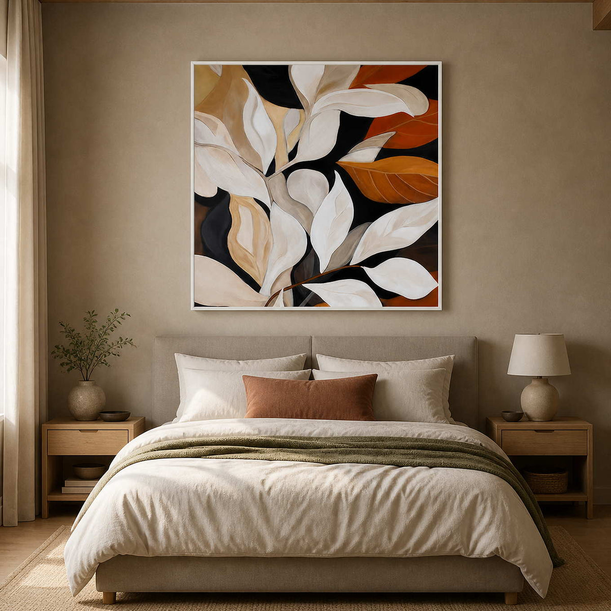 White framed cream and rust botanical painting above a softly upholstered bedroom headboard.