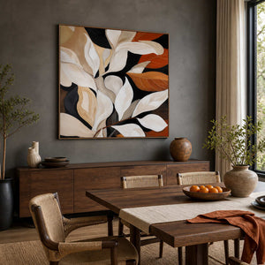 Wood framed autumn leaf painting above a dining sideboard beside a wooden table.