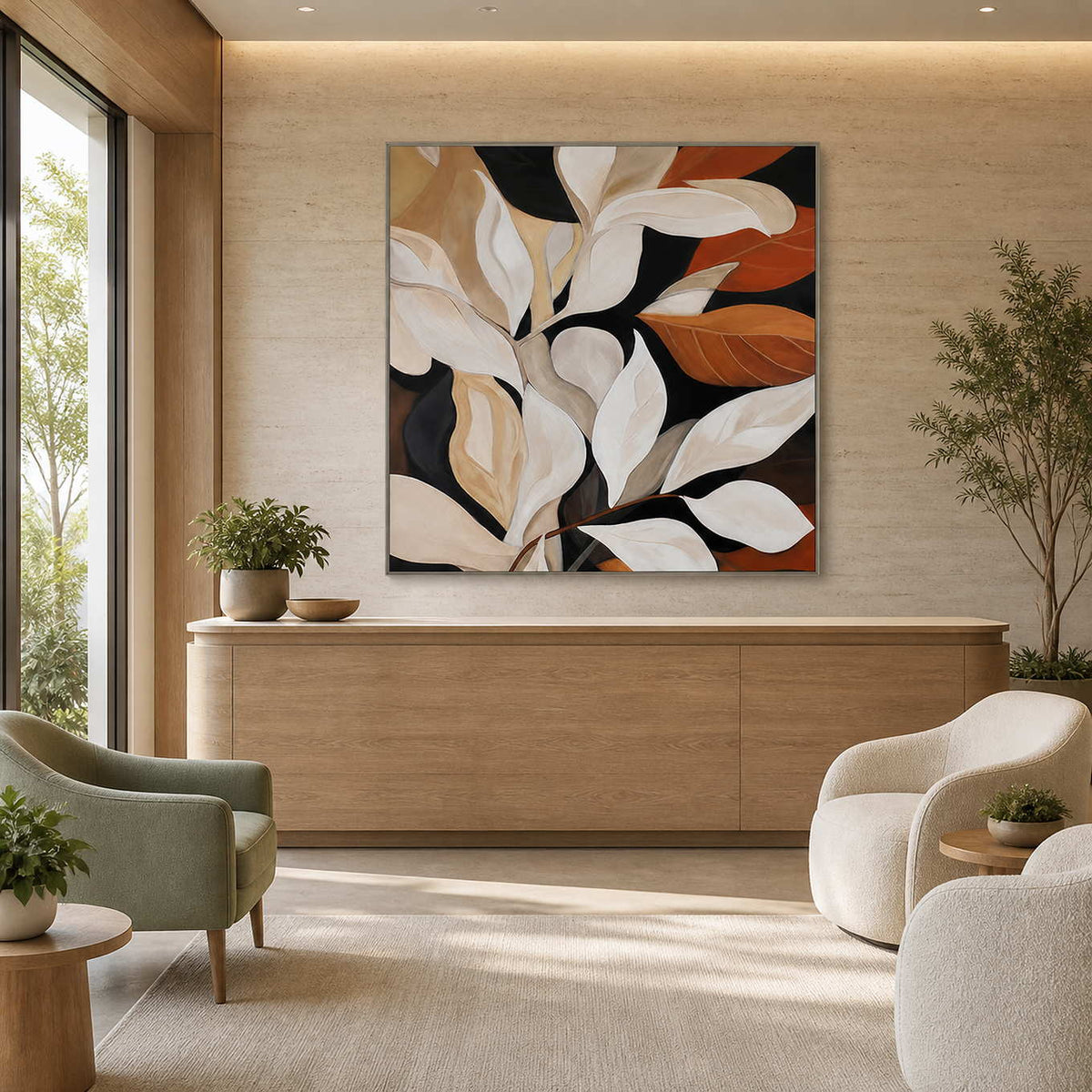 Silver framed botanical painting with cream leaves above a wellness reception counter.