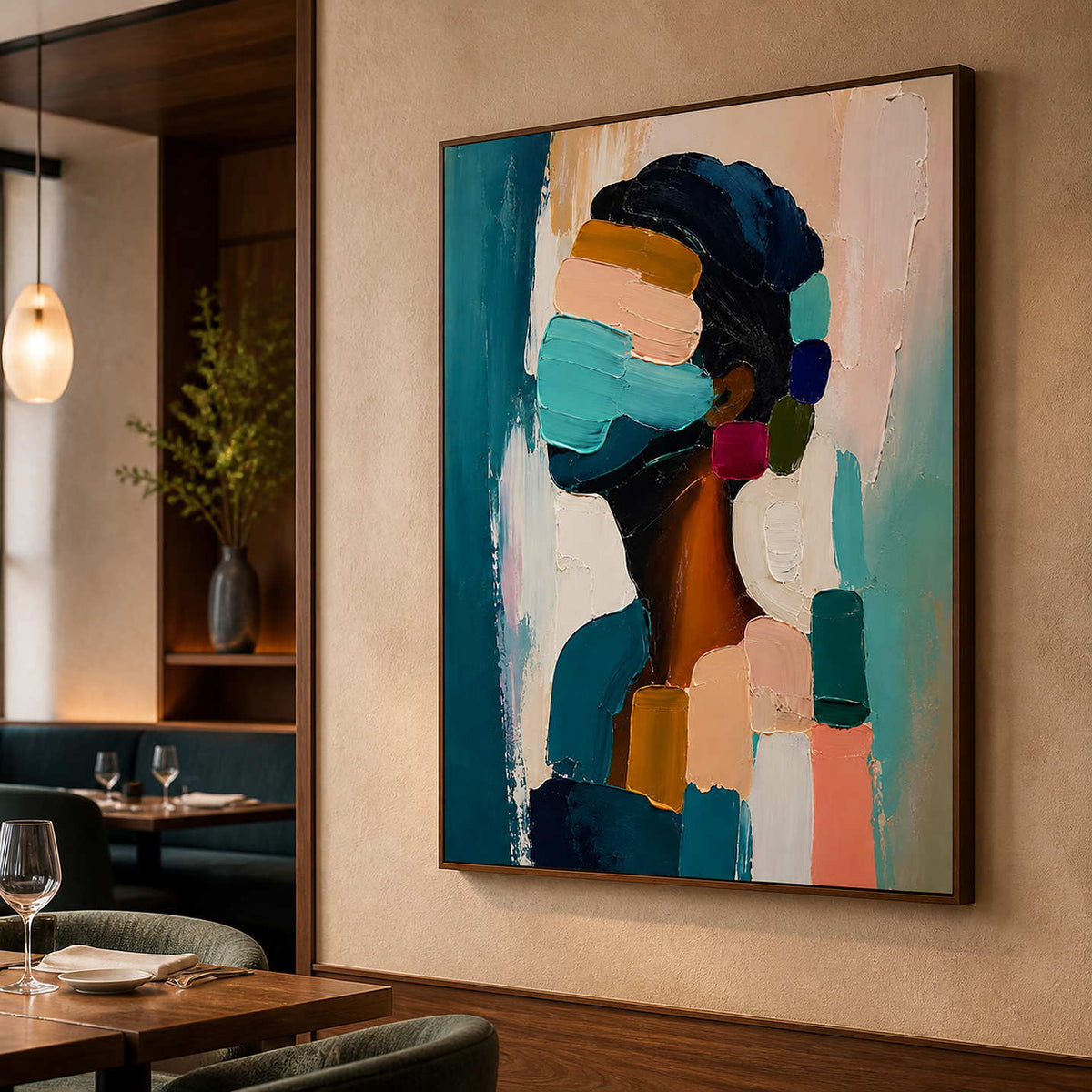 Expressive figurative wall art displayed in a warm fine dining room.