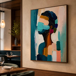 Expressive figurative wall art displayed in a warm fine dining room.