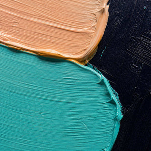 Close-up of raised turquoise, blush, ochre, and navy palette-knife texture.