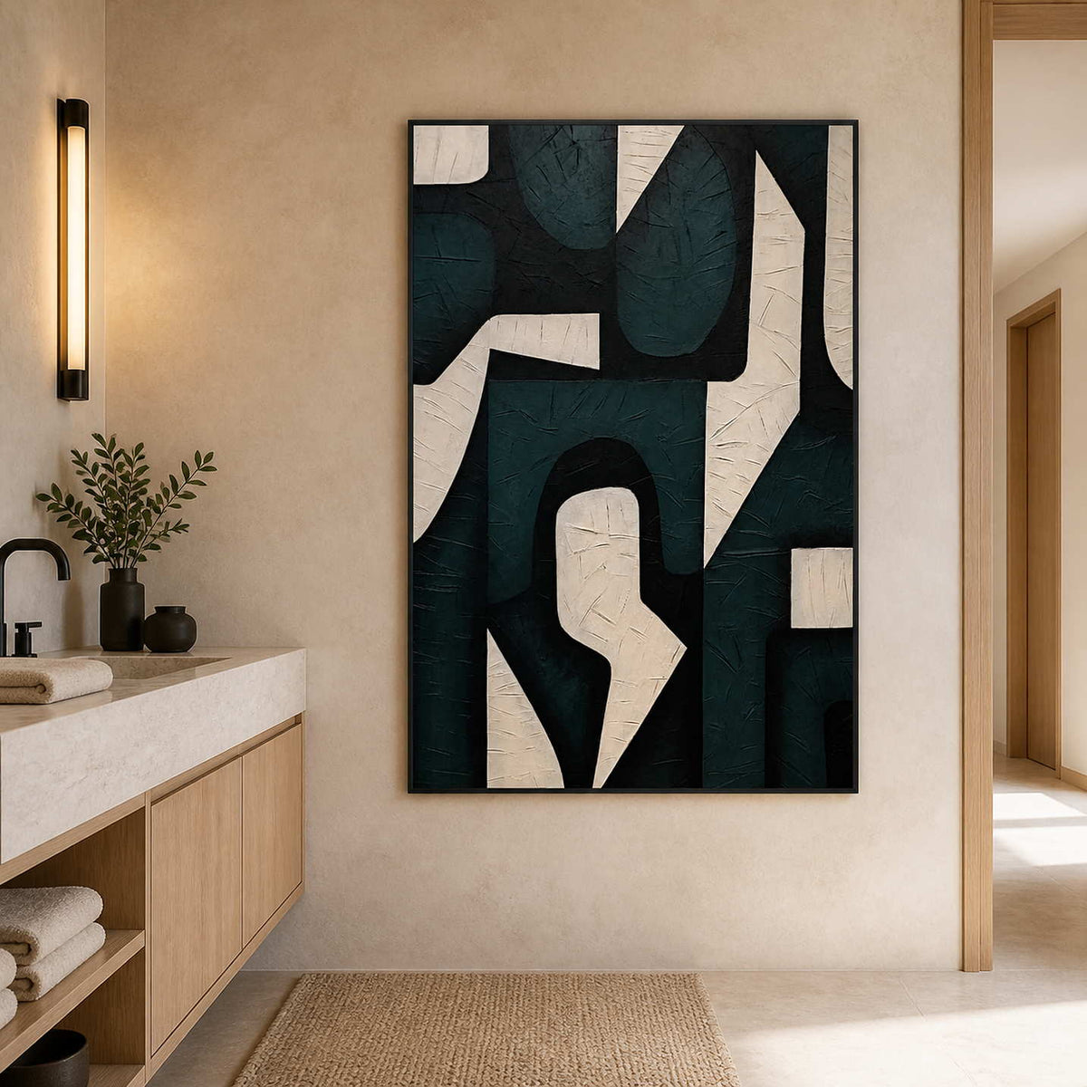 Black framed geometric shapes beside a stone basin and wooden bathroom cabinets.