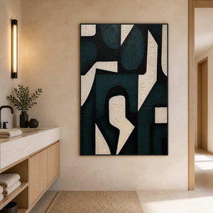 Black framed geometric shapes beside a stone basin and wooden bathroom cabinets.