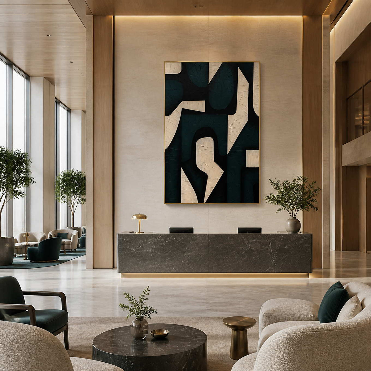 Gold framed green abstraction above a marble reception desk in a spacious lobby.