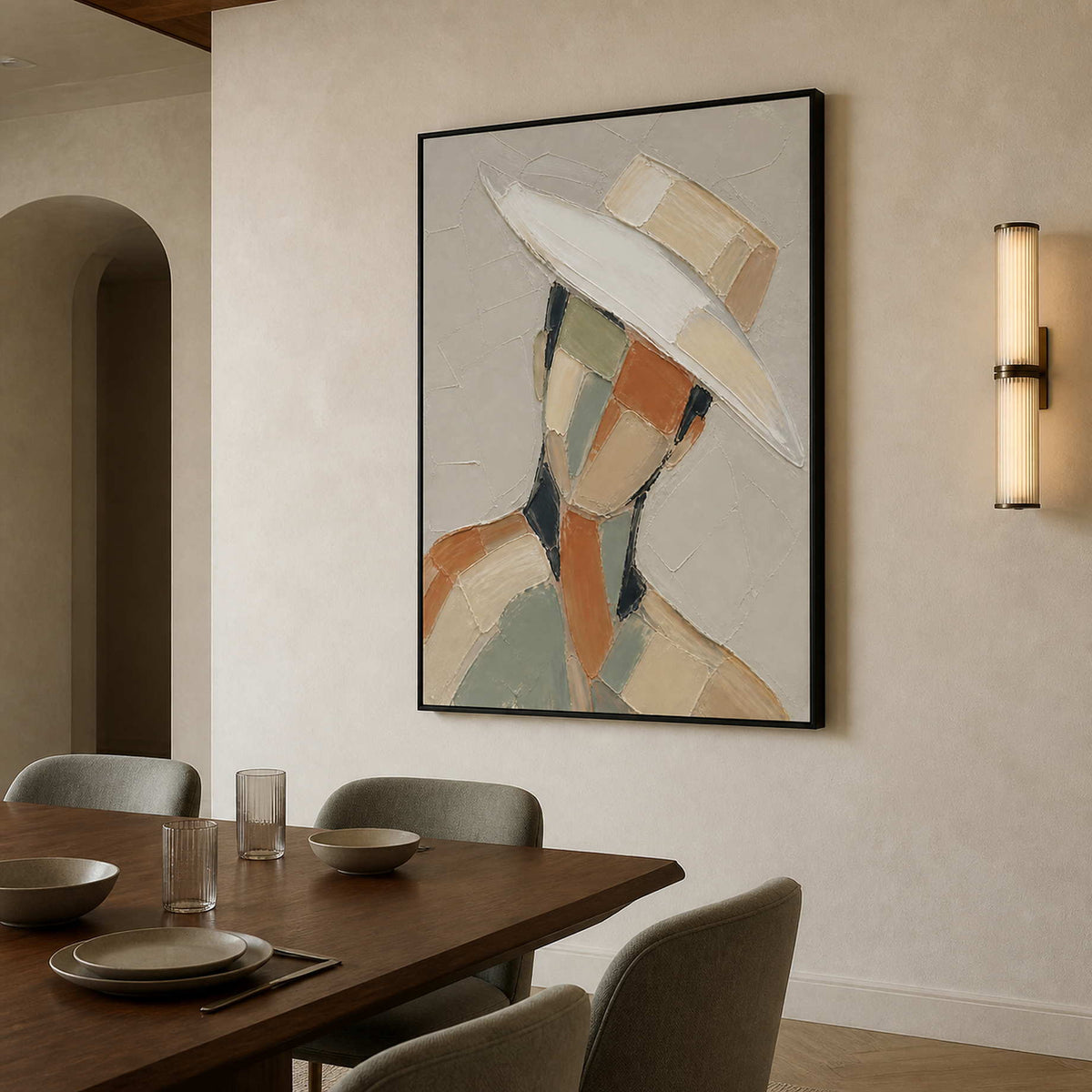 Textured modern portrait wall art in a dining room with a black frame.