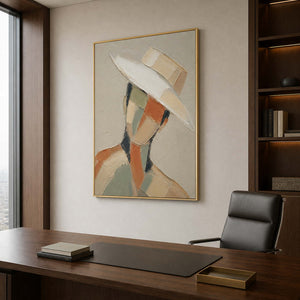 Contemporary faceless portrait wall art in a private office with a gold frame.