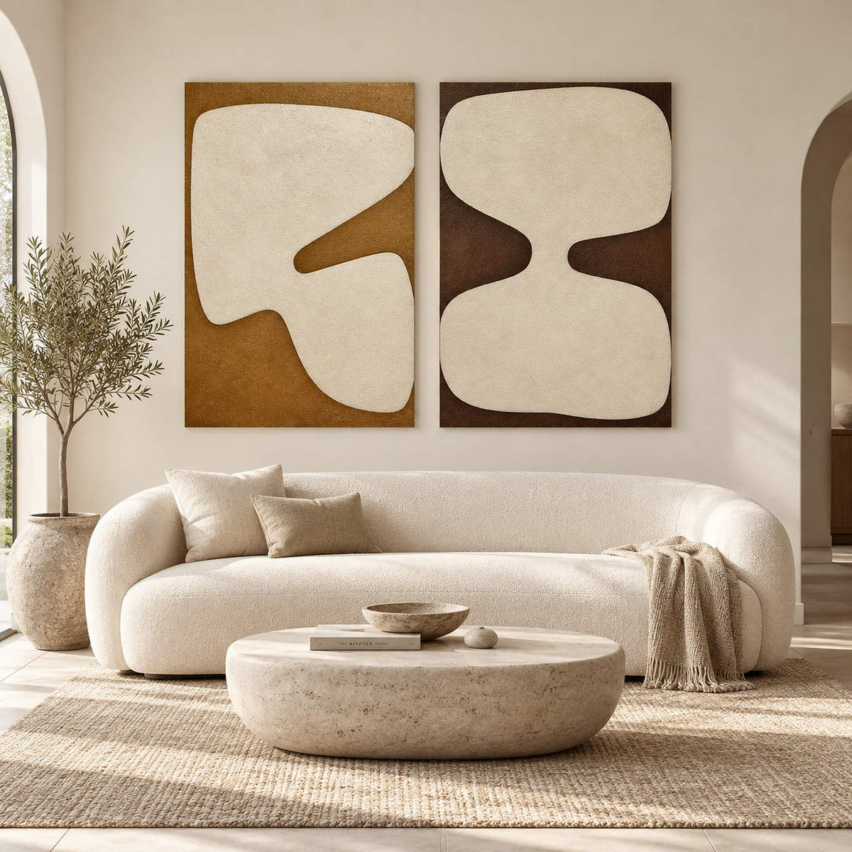 Hand-painted abstract two-panel set in ivory, ochre, and deep brown, displayed in a living room without outer frames.