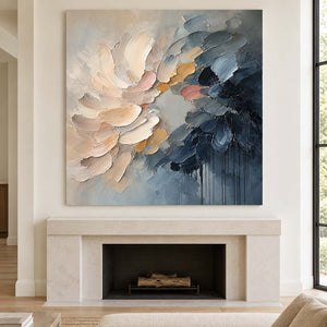 Layered cream and blush petals fading into deep blue without an outer frame, displayed above a fireplace.