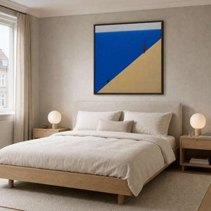 Blue minimalist wall art styled above a Copenhagen bedroom.