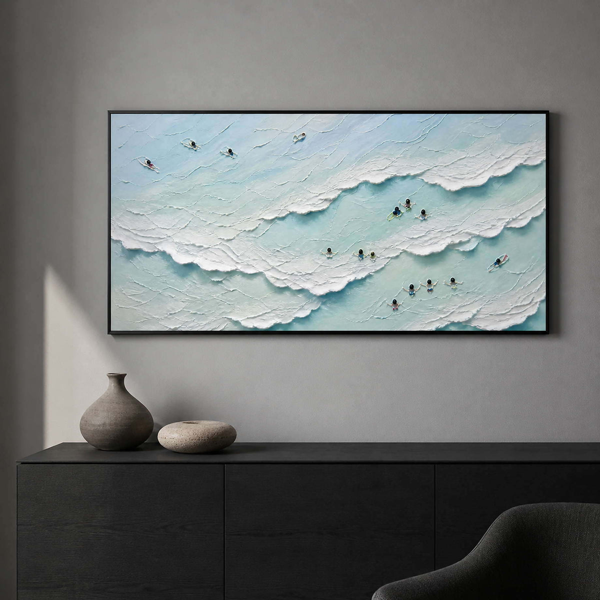 Sea-glass blue wave artwork bringing movement to a dark modern office.