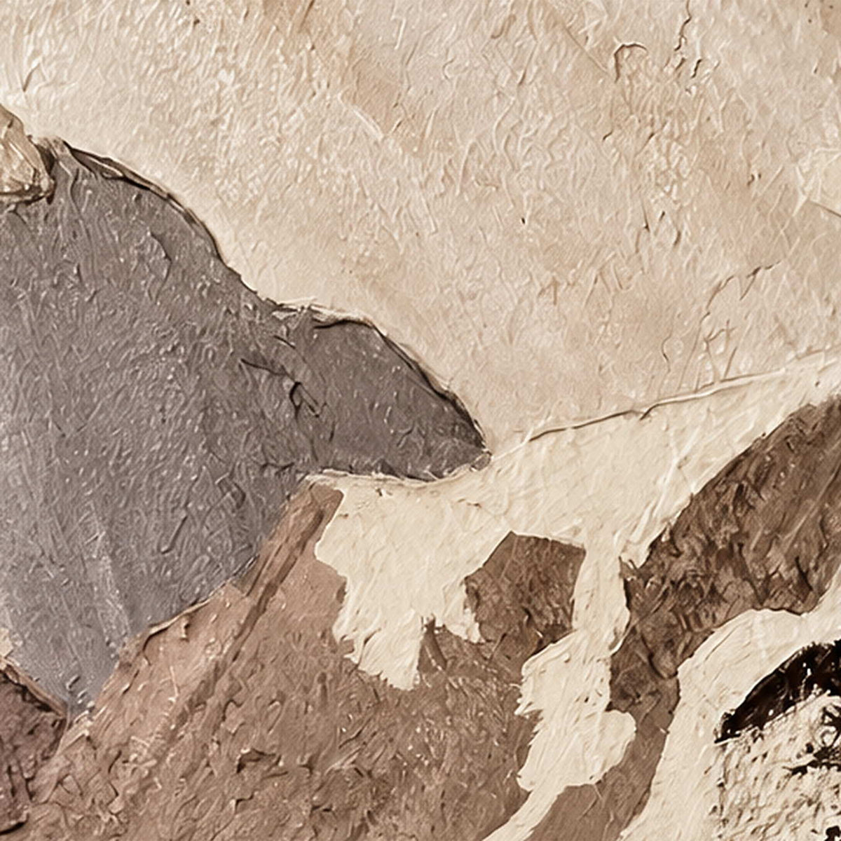 Close view of raised ivory and gray mountain planes with rough brown painted edges.