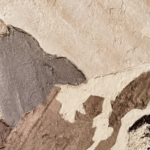 Close view of raised ivory and gray mountain planes with rough brown painted edges.