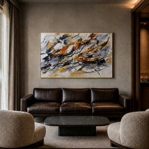 Bold black and rust abstract wall art displayed in a boutique hotel lounge.