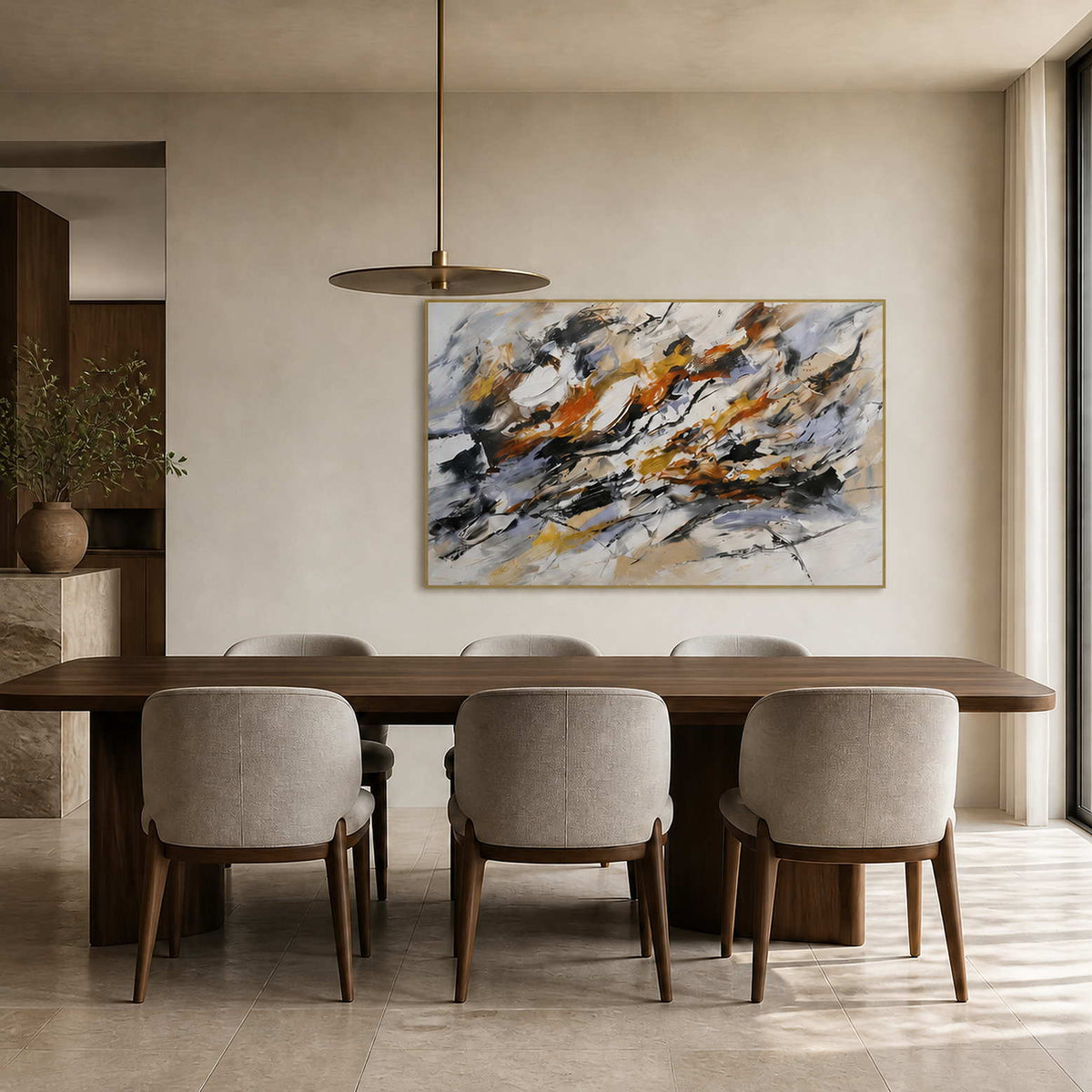 Textured black and ochre abstract art displayed in a contemporary dining room.