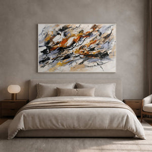 Black, rust, and neutral abstract artwork styled above a warm gray bedroom.