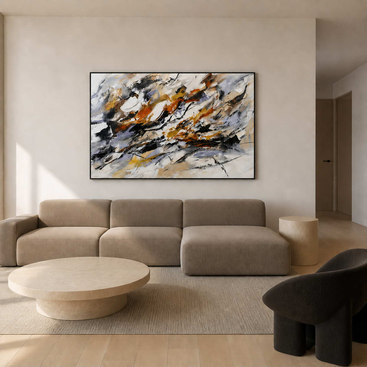 Black, rust, and ochre abstract wall art displayed in a warm white modern living room.