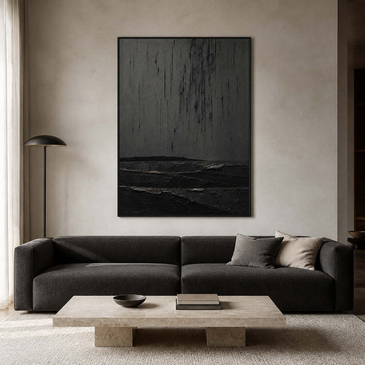 Textured black abstract wall art displayed in a neutral modern living room.