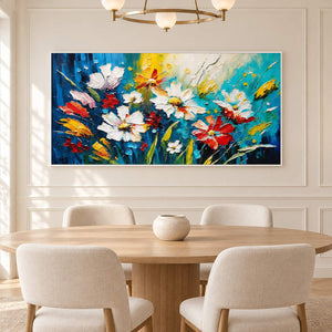 Hand-painted panoramic floral wall art in cobalt, turquoise, white, red, and yellow, displayed in a dining room in a white frame.