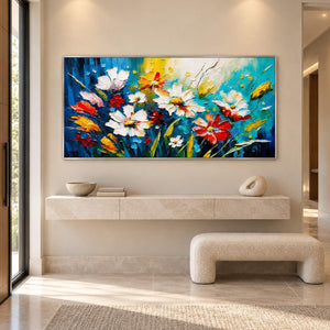 Hand-painted panoramic floral wall art in cobalt, turquoise, white, red, and yellow, displayed in an entrance hall in a silver frame.