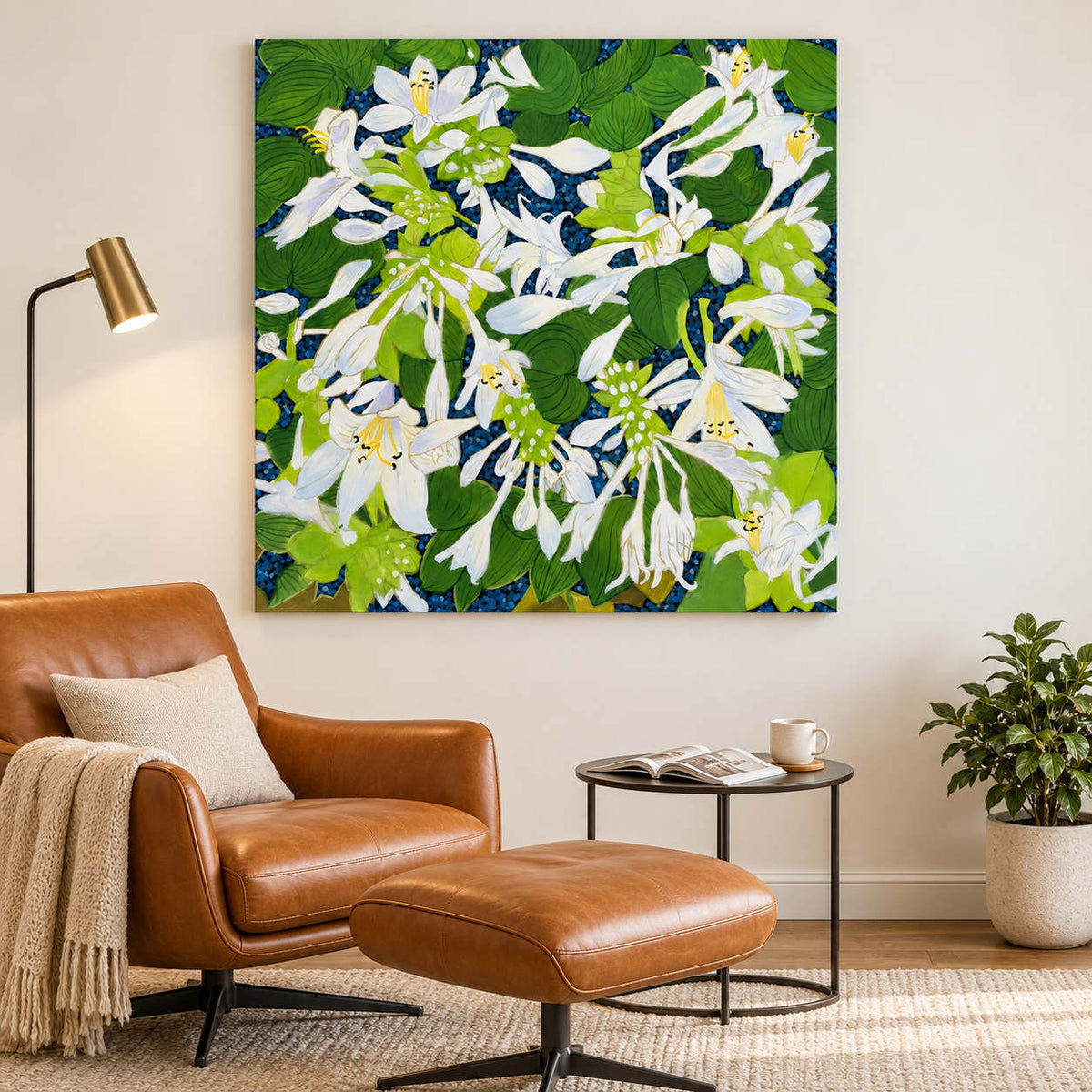 Beside a reading chair, an artwork with no outer frame shows white flowers and broad green leaves over a deep blue ground.