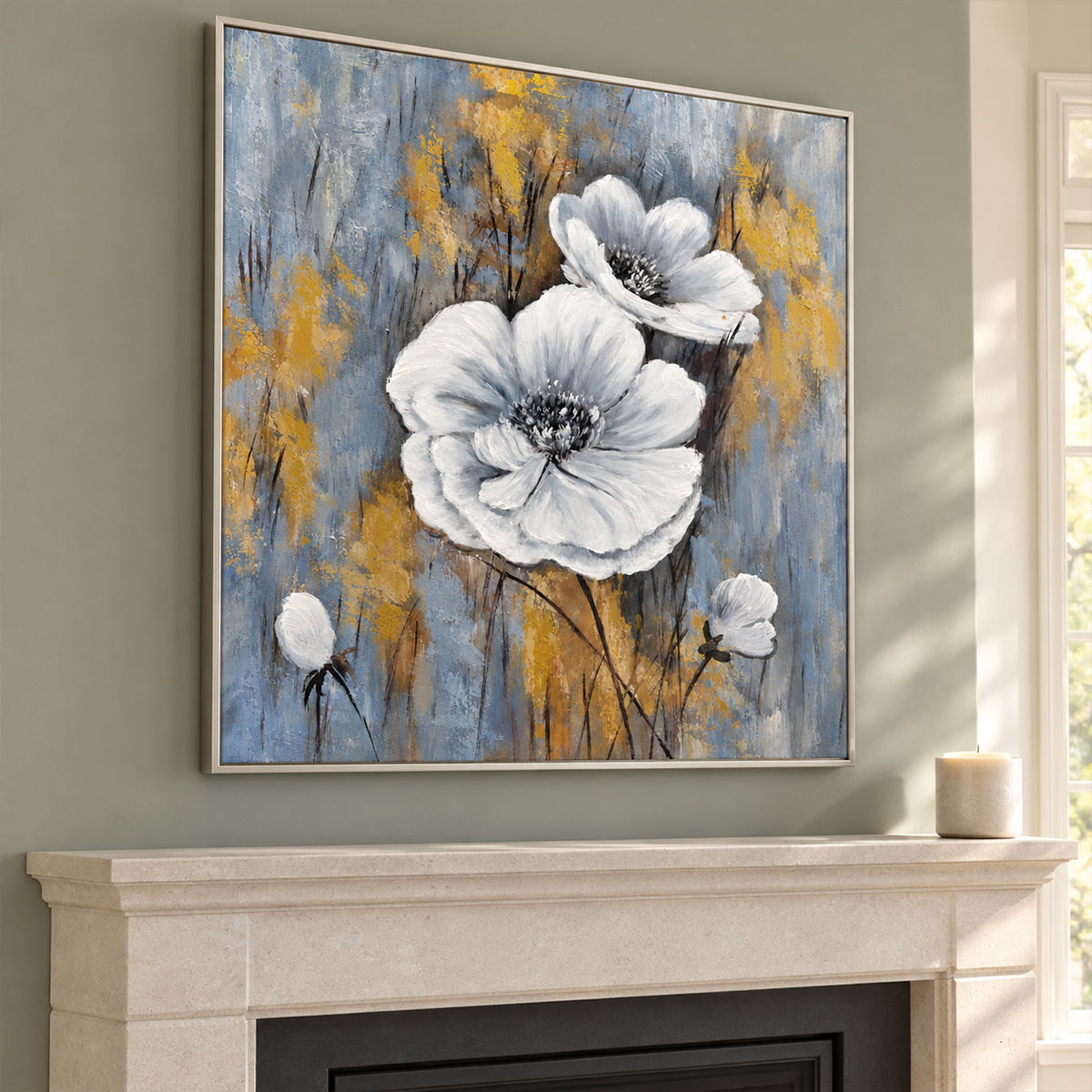 Above a fireplace, an artwork with a silver-colored frame shows two large white flowers and small buds on a blue-gray ground with ochre marks.