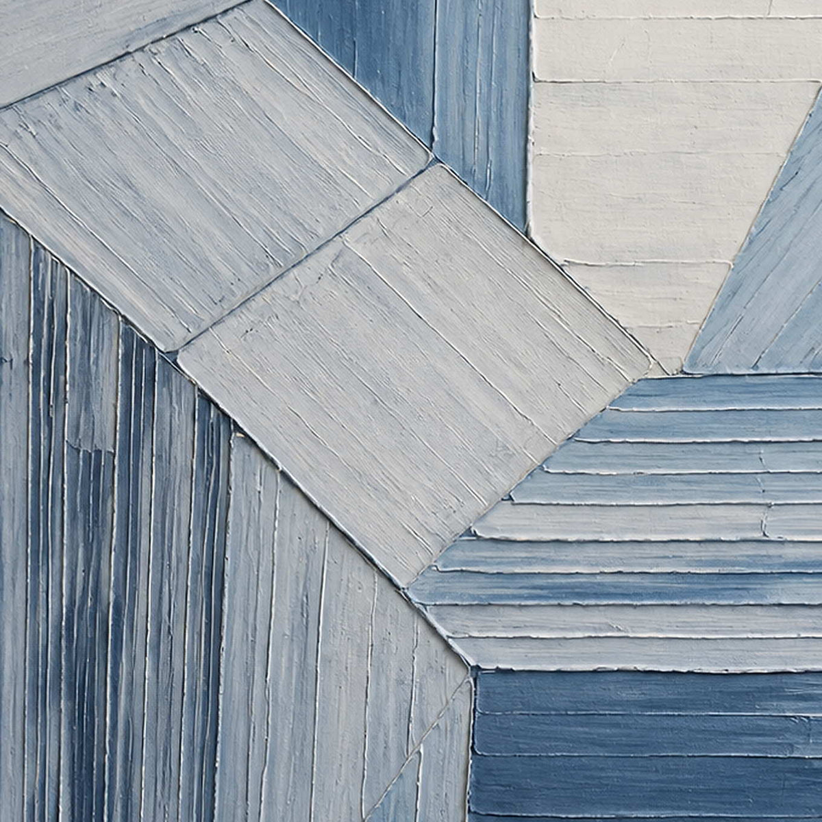 Close-up of the painted texture in indigo and white geometric forms.