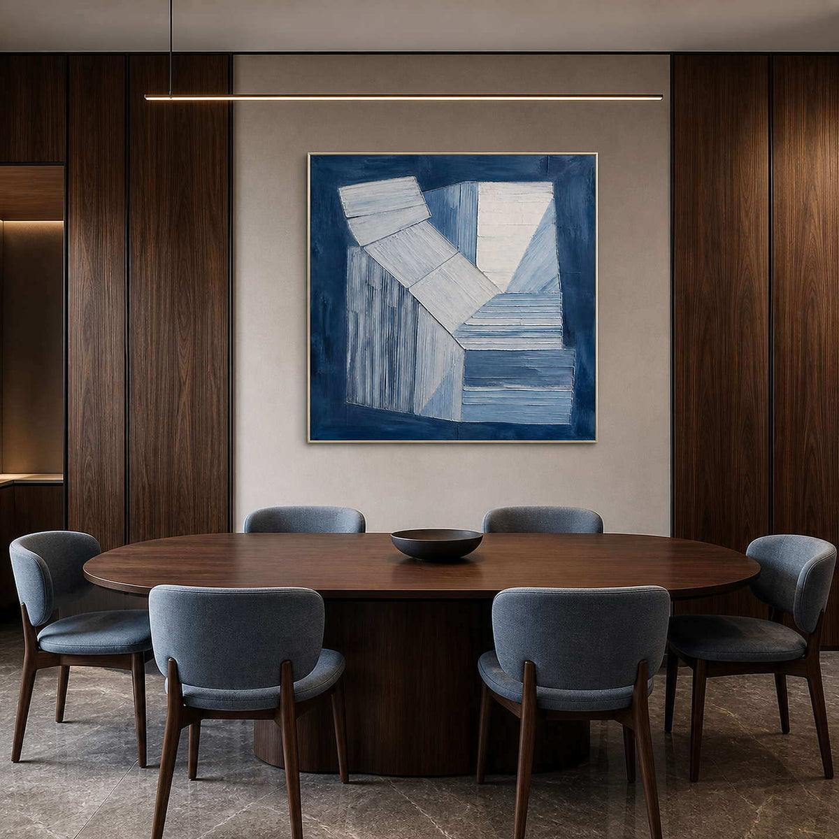 Indigo and white geometric forms wall art in a contemporary dining room.