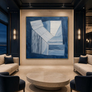 Indigo and white geometric forms wall art in a contemporary hospitality lounge.