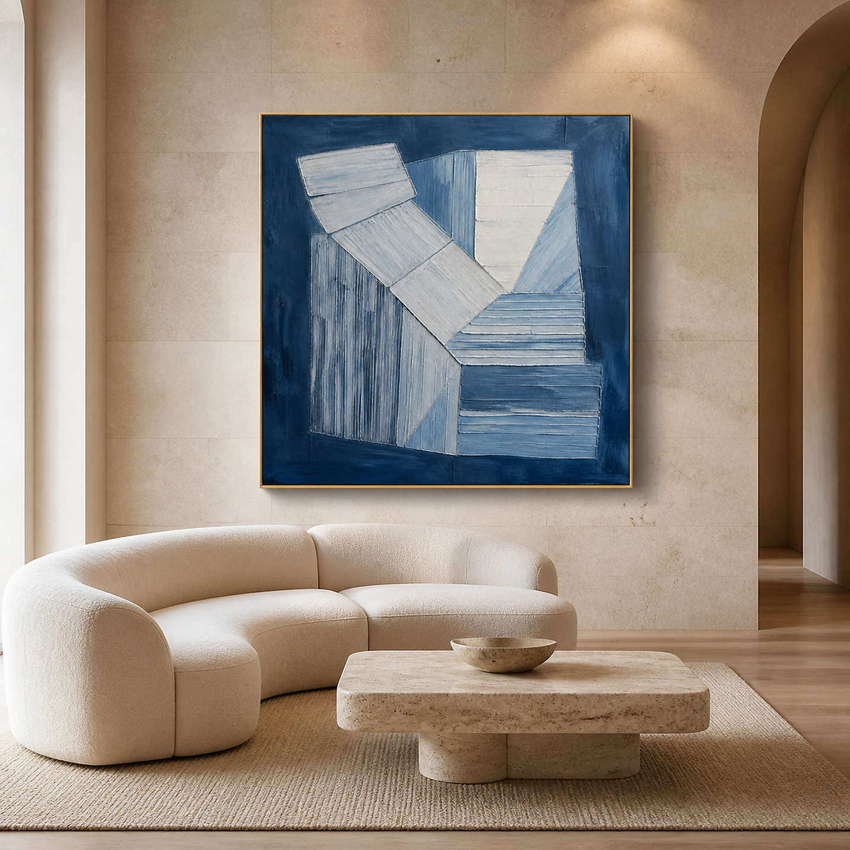 Indigo and white geometric forms wall art in a contemporary living room.