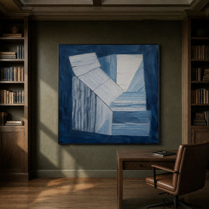 Indigo and white geometric forms wall art in a contemporary stair hall.
