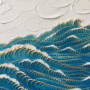 Close-up of the painted texture in deep blue waves edged with gold.