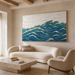 Deep blue waves edged with gold wall art in a contemporary living room.
