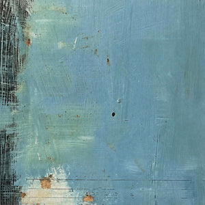 Close-up of scraped aqua paint, dark edges, and warm rust marks.