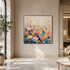 Colorful floral wall art displayed in a luxury hotel lobby.