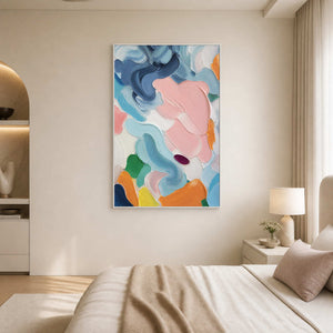 Soft colorful abstract canvas brings calm movement to a neutral bedroom.