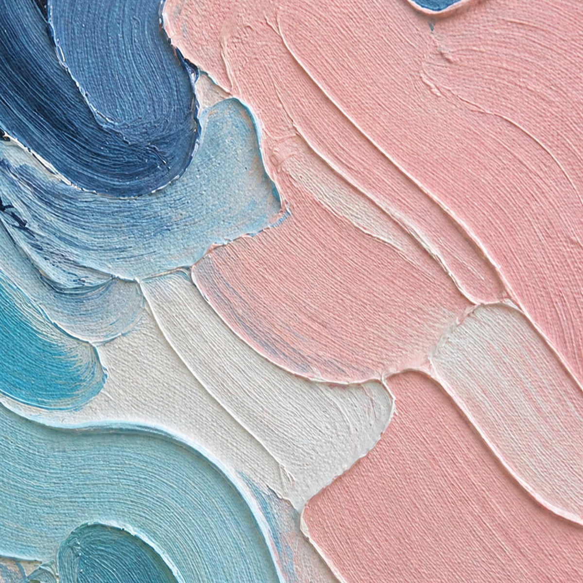 Close-up of layered blush pink, navy, powder blue, and ivory brush texture.