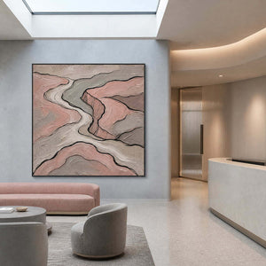Blush and gray contour lines wall art in a contemporary commercial lobby.