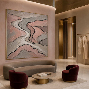 Blush and gray contour lines wall art in a contemporary hospitality lounge.