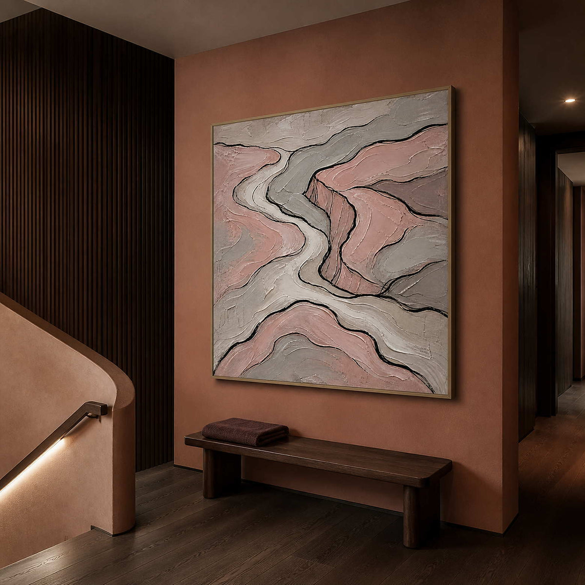 Blush and gray contour lines wall art in a contemporary stair hall.