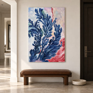 Branching deep blue forms curling upward over pale pink, cream and red in an artwork with no outer frame, displayed in an entryway above a console or bench.