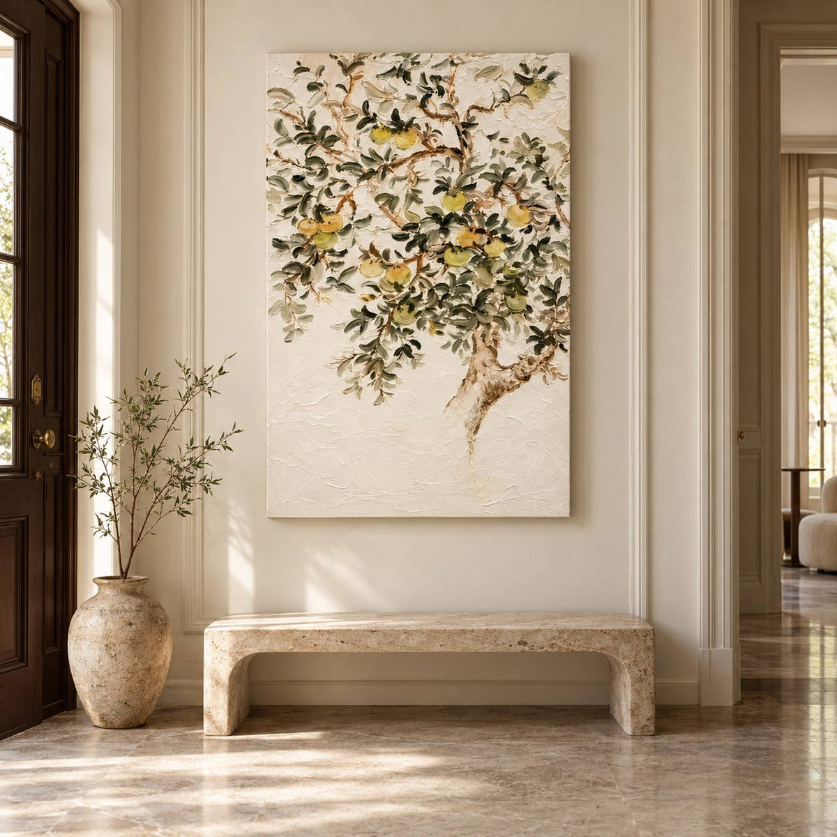 In an entryway above a console or bench, an artwork with no outer frame shows branching gray-green leaves and pale yellow-green fruit on cream.