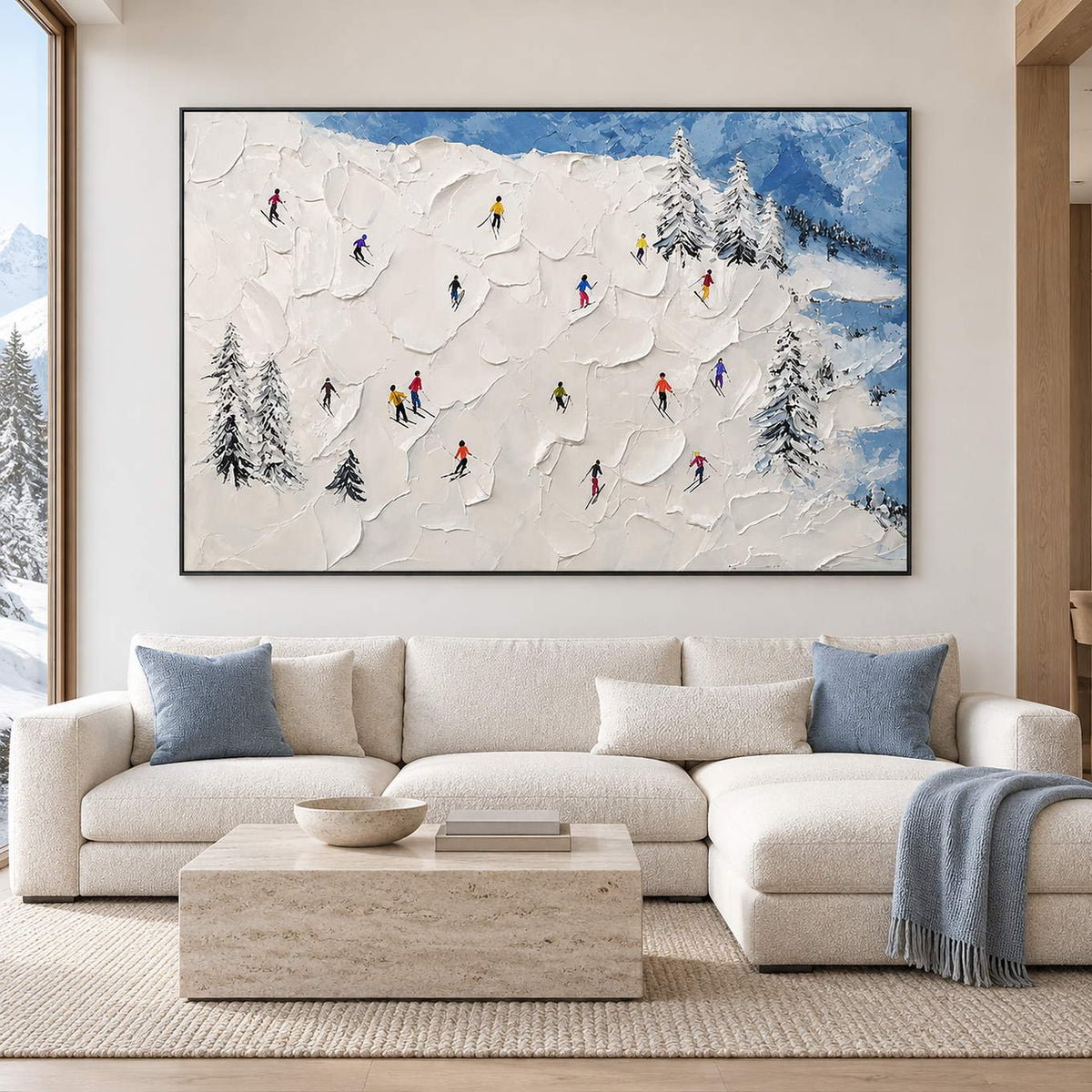 Hand-painted snowy mountain canvas with colorful skiers and pine trees, displayed in a living room in a black frame.